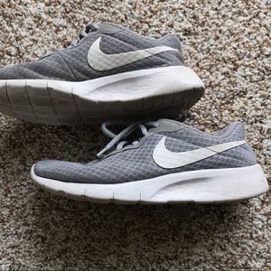 Youth gray Nike athletic shoes